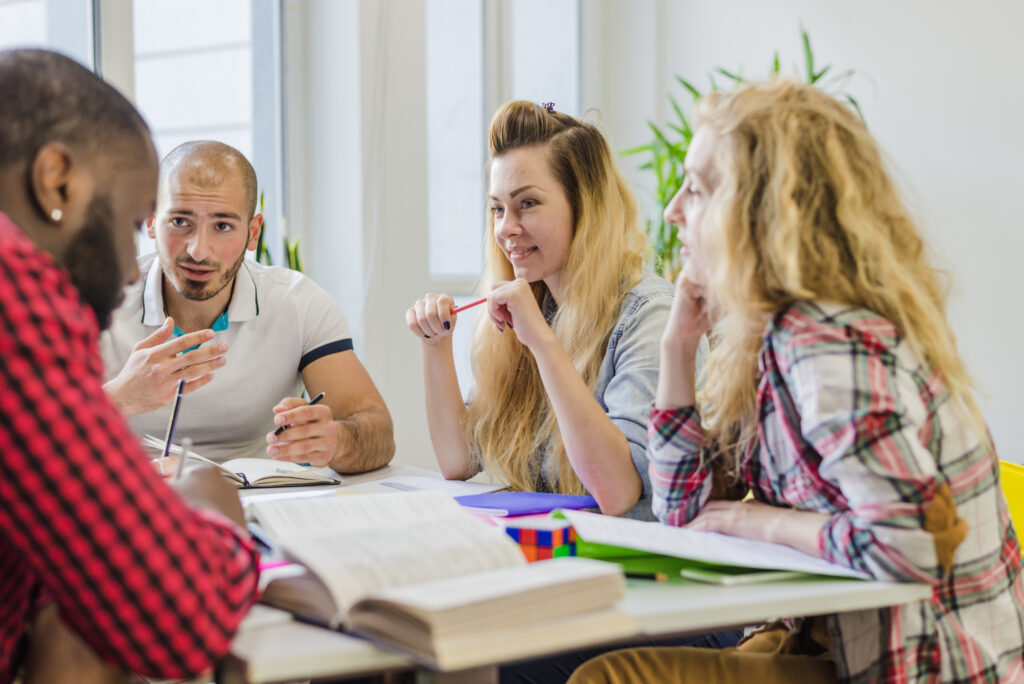 Expats doing Dutch homework together.