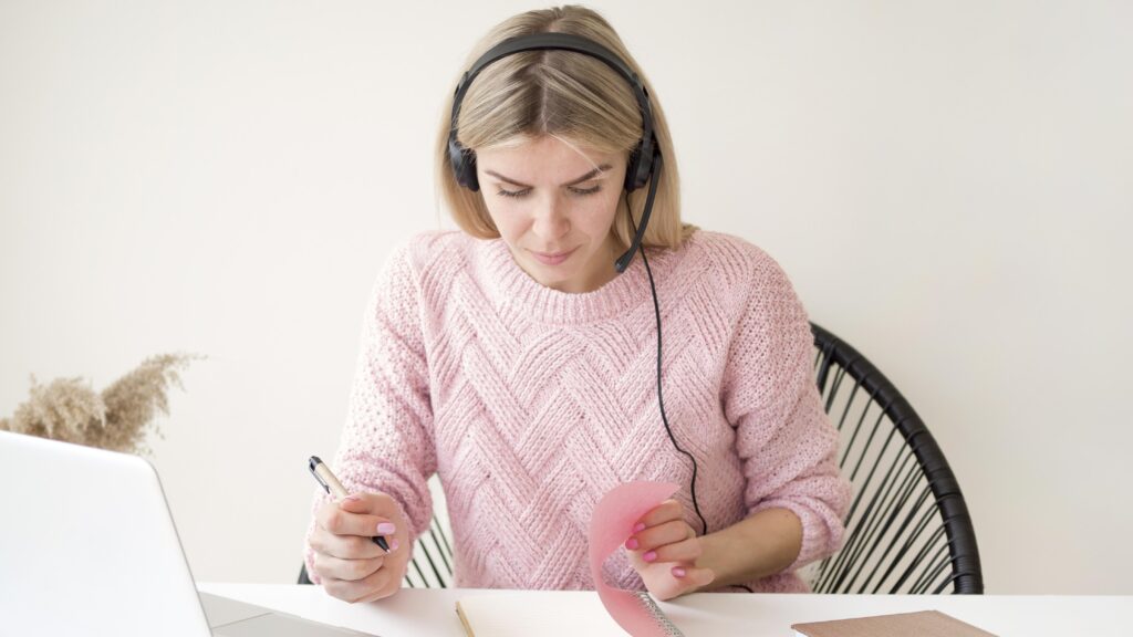 Student with headphones practicing Dutch.