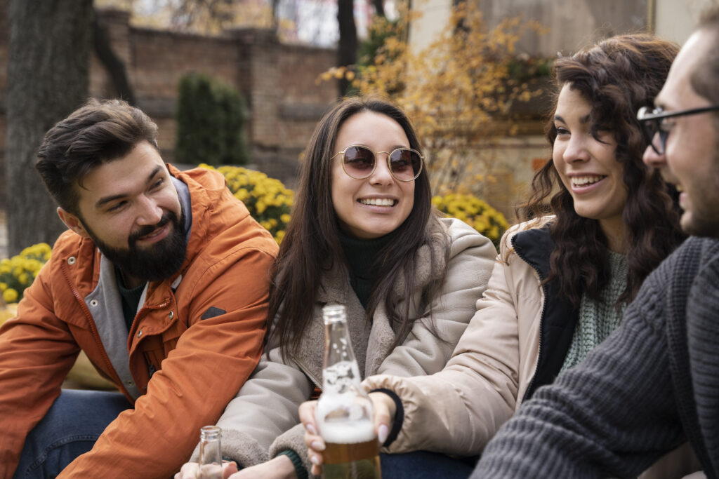 Expat friends speaking Dutch together on a sunny day.