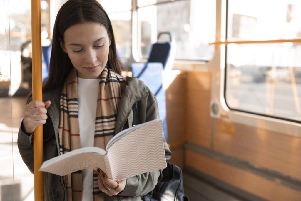 Expat going through Dutch notes during commute to work.